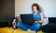 Image of a woman at home usingCommercial Borderless Banking